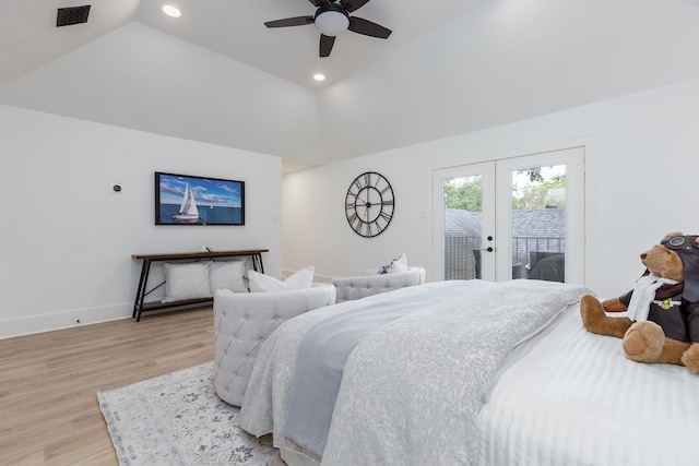 bedroom with lofted ceiling, access to outside, ceiling fan, light wood-type flooring, and french doors