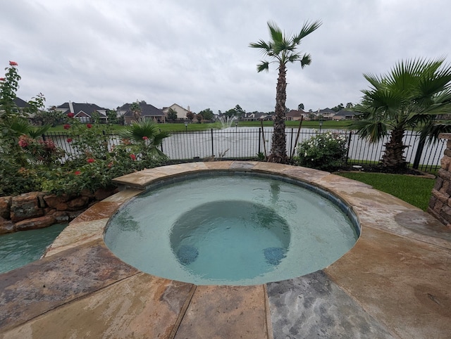 view of pool featuring an in ground hot tub