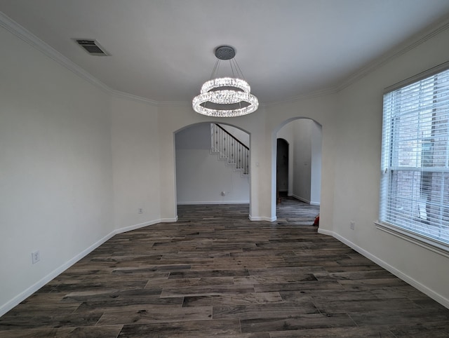 unfurnished dining area with dark hardwood / wood-style floors, a chandelier, and ornamental molding