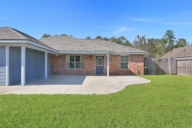 view of front of property featuring a front lawn and a patio area