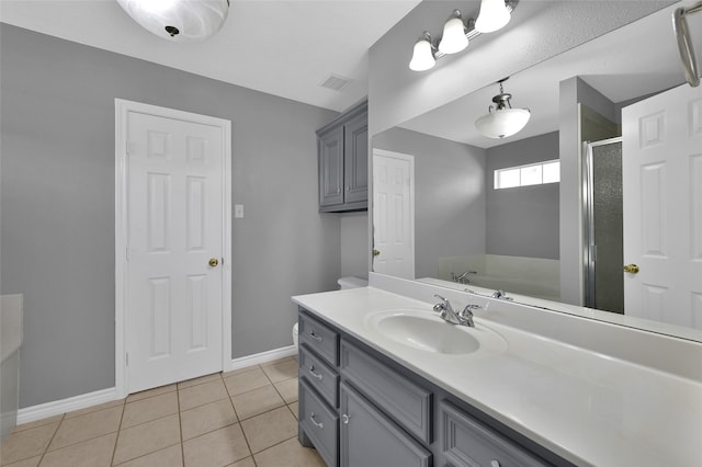 bathroom with vanity, plus walk in shower, and tile patterned floors