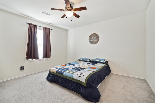 carpeted bedroom with ceiling fan