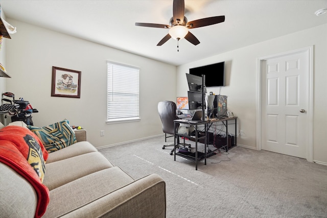 carpeted home office with ceiling fan