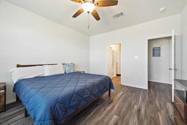 bedroom with ceiling fan and dark hardwood / wood-style floors