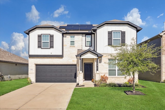 view of front facade featuring a front lawn, a garage, and solar panels