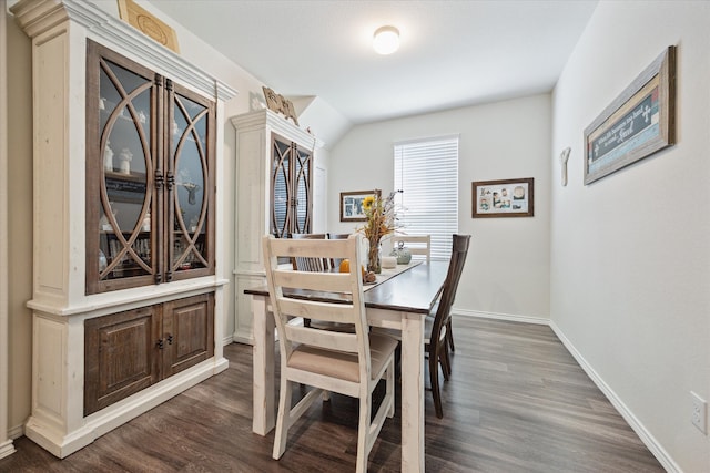 dining area with dark hardwood / wood-style flooring