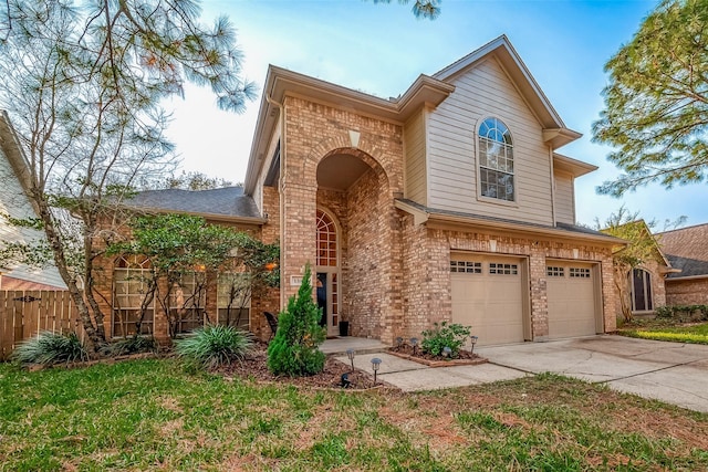 view of front of property featuring a garage and a front lawn