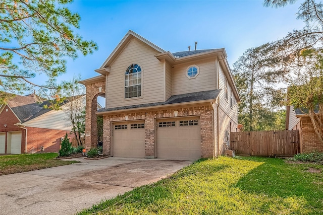 view of property with a front lawn and a garage