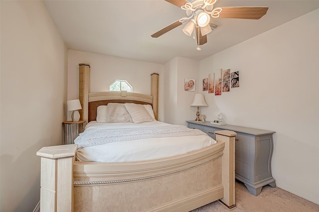 bedroom with ceiling fan and light carpet