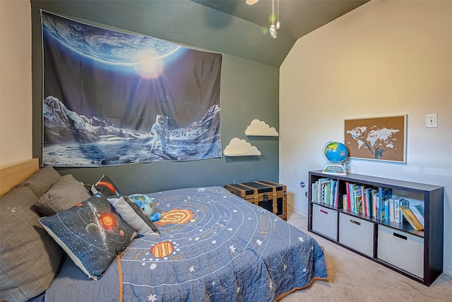 carpeted bedroom featuring lofted ceiling