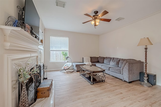 living room featuring light hardwood / wood-style floors and ceiling fan