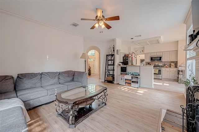 living room featuring ceiling fan and light hardwood / wood-style floors