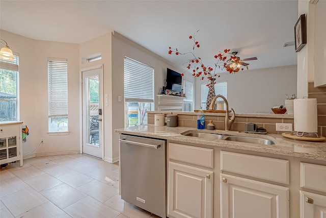 kitchen featuring white cabinets, dishwasher, sink, light tile patterned flooring, and ceiling fan