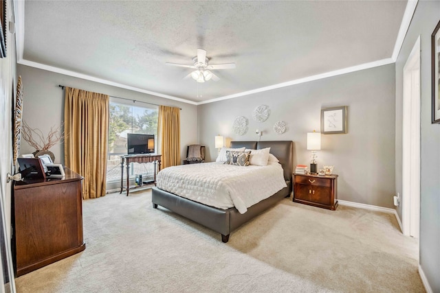 carpeted bedroom featuring a textured ceiling, ceiling fan, and crown molding