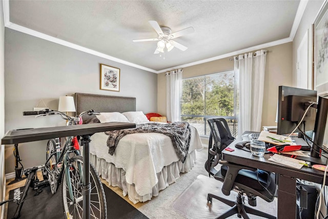 bedroom with ceiling fan, a textured ceiling, crown molding, and carpet