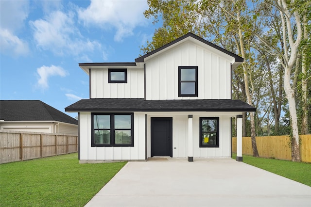 exterior space featuring a front lawn and covered porch