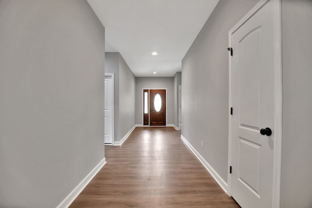 entryway with hardwood / wood-style floors