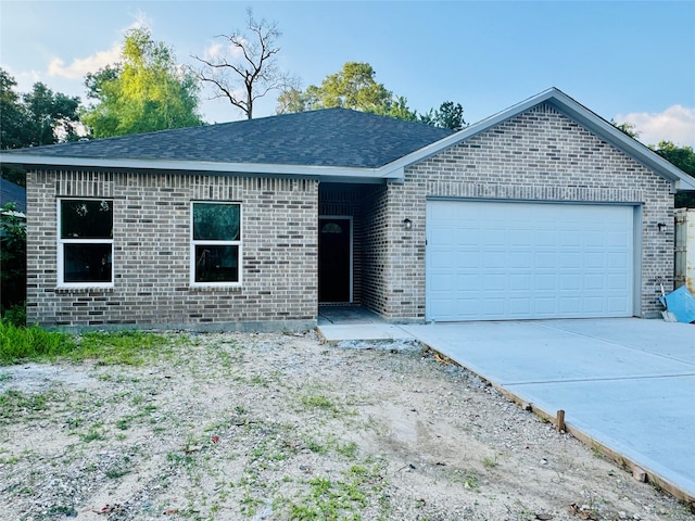 single story home with a garage