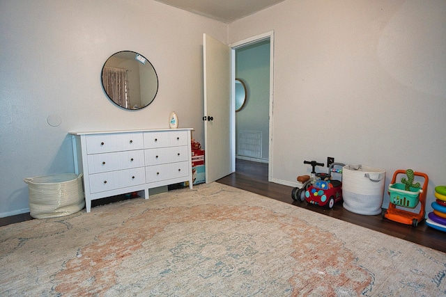 bedroom featuring dark hardwood / wood-style floors