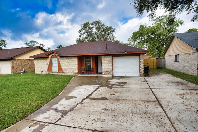 ranch-style home featuring a front lawn and a garage