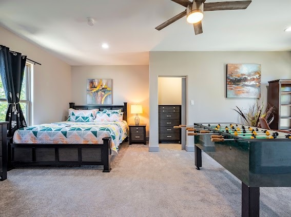 carpeted bedroom with ceiling fan