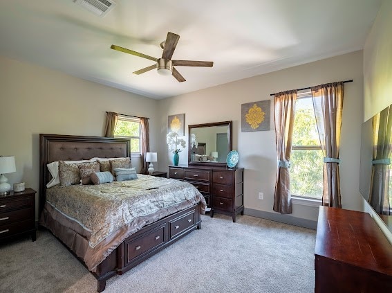 carpeted bedroom featuring ceiling fan