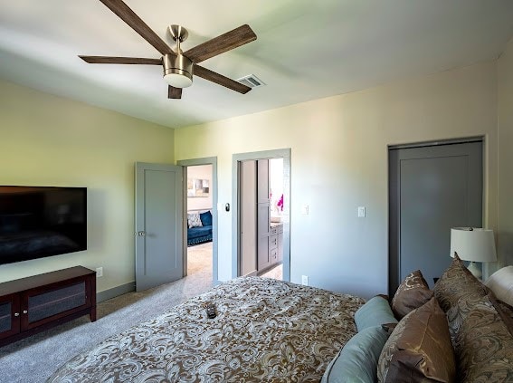 carpeted bedroom featuring ceiling fan