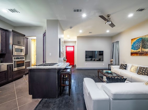 living room with dark hardwood / wood-style floors