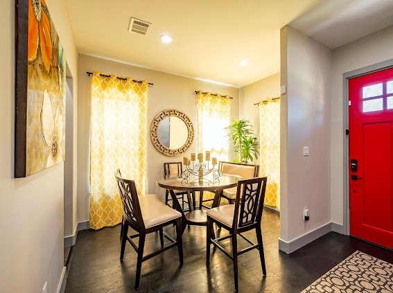 dining area with dark hardwood / wood-style floors