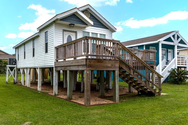 rear view of house featuring central AC, a yard, and a deck