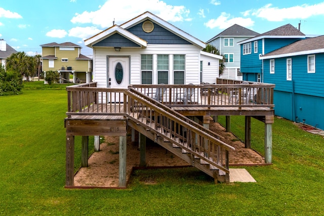 back of property featuring a yard and a deck