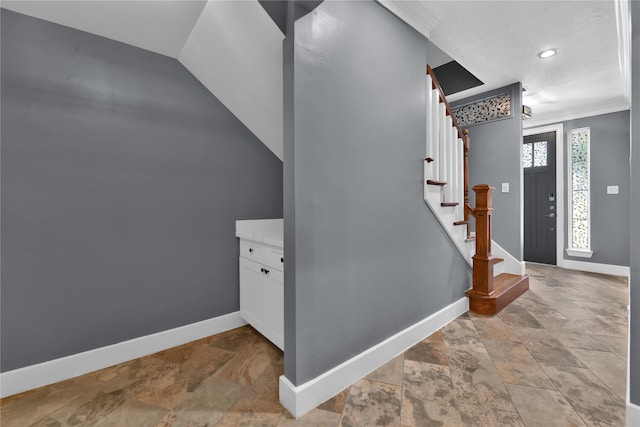 staircase featuring ornamental molding