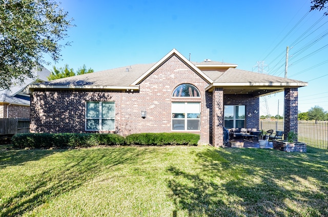 back of property featuring a yard and a patio area