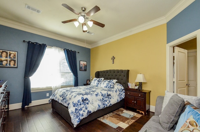 bedroom with ceiling fan, dark hardwood / wood-style floors, and crown molding