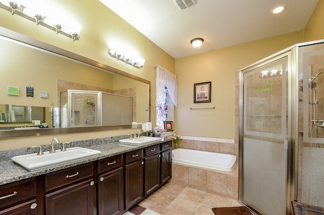 bathroom featuring vanity, tile patterned floors, and separate shower and tub