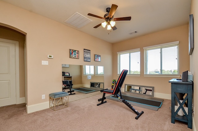 workout area with light colored carpet and ceiling fan