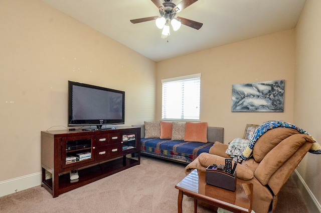 living room featuring lofted ceiling, carpet flooring, and ceiling fan