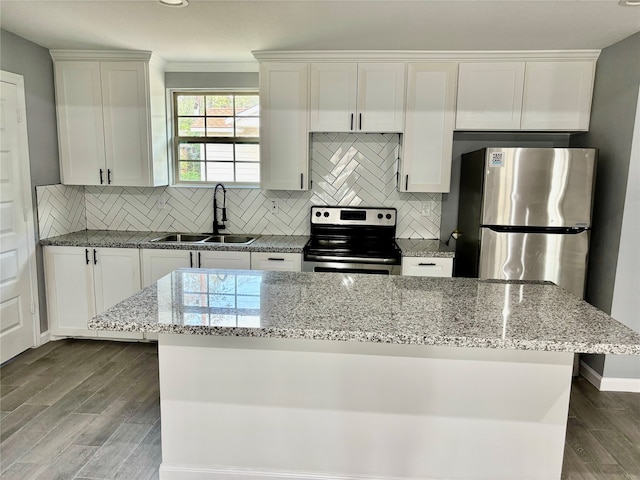 kitchen featuring white cabinets, stainless steel appliances, sink, and dark hardwood / wood-style flooring