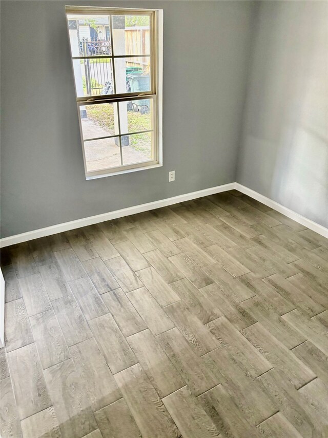 spare room featuring light hardwood / wood-style floors