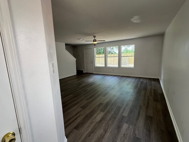 interior space featuring dark hardwood / wood-style floors and ceiling fan