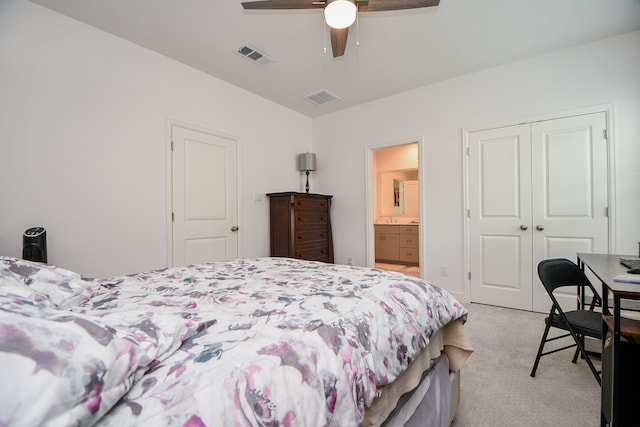 carpeted bedroom featuring ceiling fan and a closet