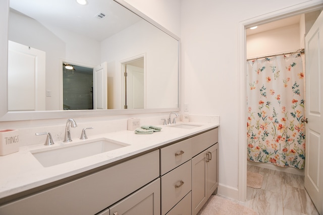 bathroom with vanity and a shower with shower curtain