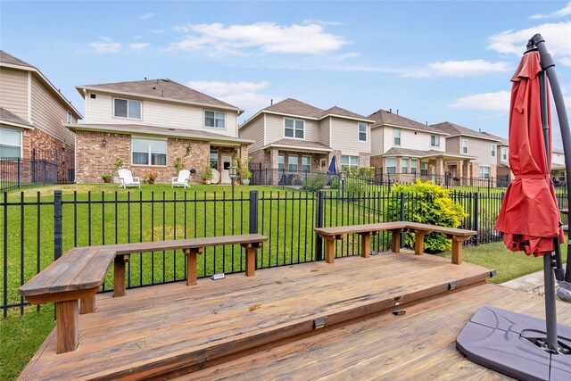 wooden terrace with a yard