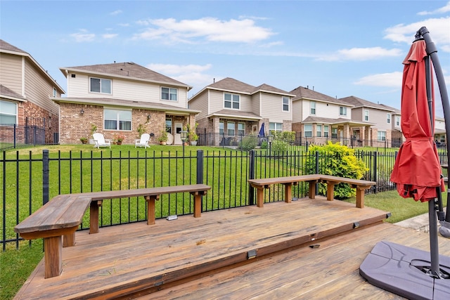 wooden terrace featuring a yard