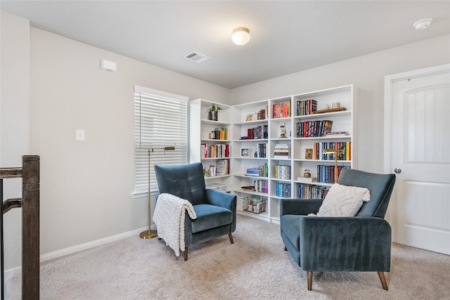 living area featuring light colored carpet