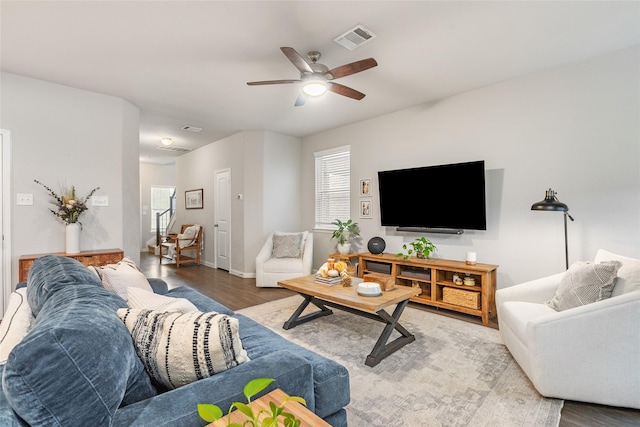 living room featuring hardwood / wood-style floors, a wealth of natural light, and ceiling fan