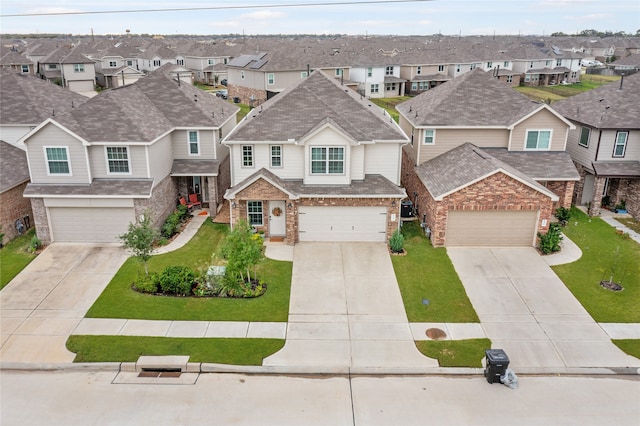 view of front of property with a garage and a front yard