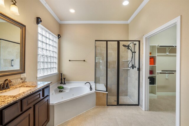 bathroom with ornamental molding, vanity, tile patterned floors, and independent shower and bath