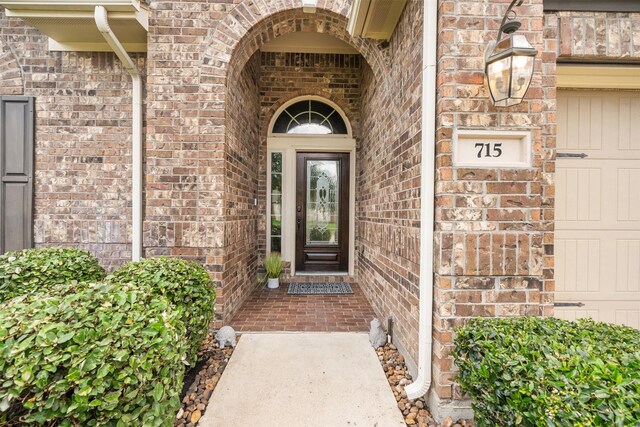 doorway to property featuring a garage