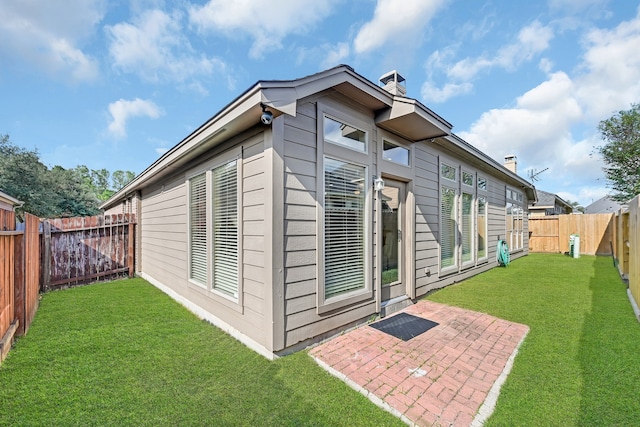 exterior space with a patio and a yard